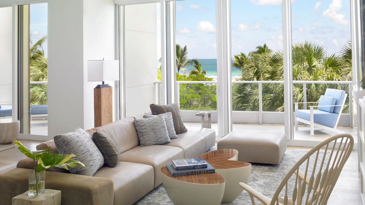 A serene living room with a breathtaking ocean view, offering a tranquil and picturesque ambiance.