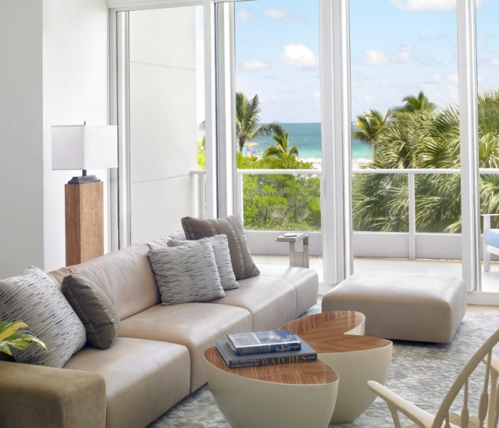 A serene living room with a breathtaking ocean view, offering a tranquil and picturesque ambiance.